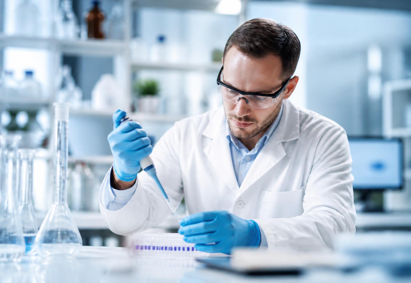Scientist using a micropipette with Borox labware in a modern laboratory